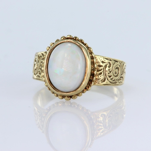 56 - 9ct yellow gold single stone ring set with an oval opal cabochon measuring approx. 10mm x 8mm, with ... 