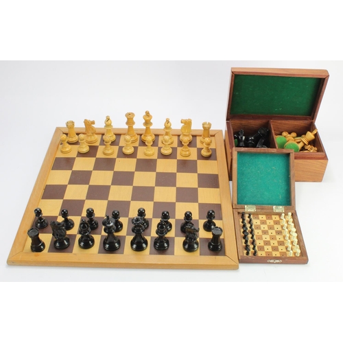 18 - Chess interest. Two complete sets of Staunton style chess pieces, together with a cased Chess set by... 
