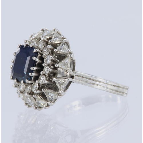 1 - White metal tests 18ct sapphire and diamond double cluster ring, emerald-cut sapphire weight approx ... 