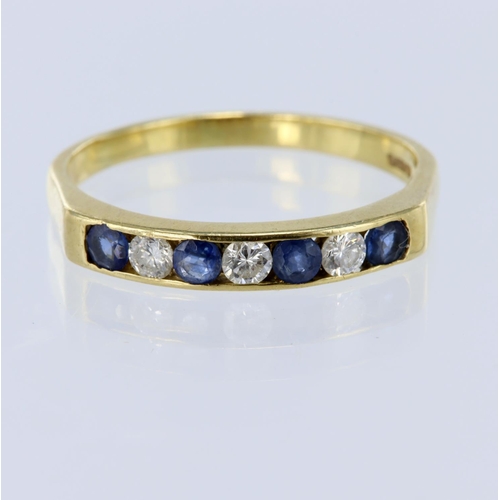 24 - 18ct yellow gold seven stone channel set ring, set with four round sapphires and three round brillia... 