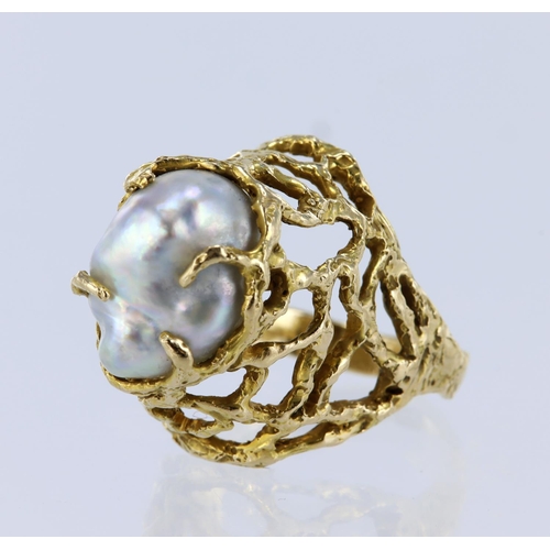 27 - 15ct yellow gold dress ring with high lattice setting holding a baroque pearl measuring approx. 15mm... 