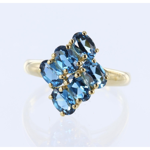 38 - 9ct yellow gold ring set with six oval blue topaz measuring approx. 6mm x 4mm, finger size T, weight... 