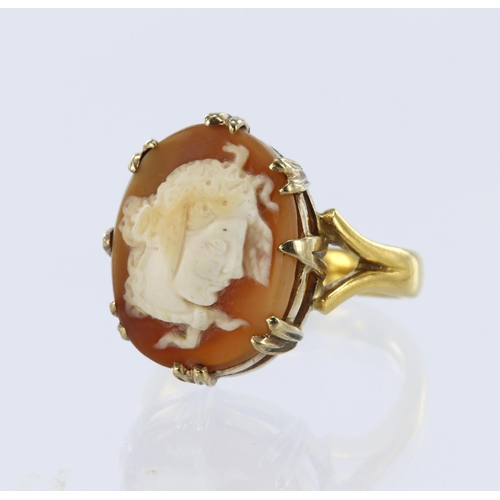 42 - 22ct yellow gold band on 9ct setting, cameo ring set with a shell cameo measuring approx. 18mm x 14m... 