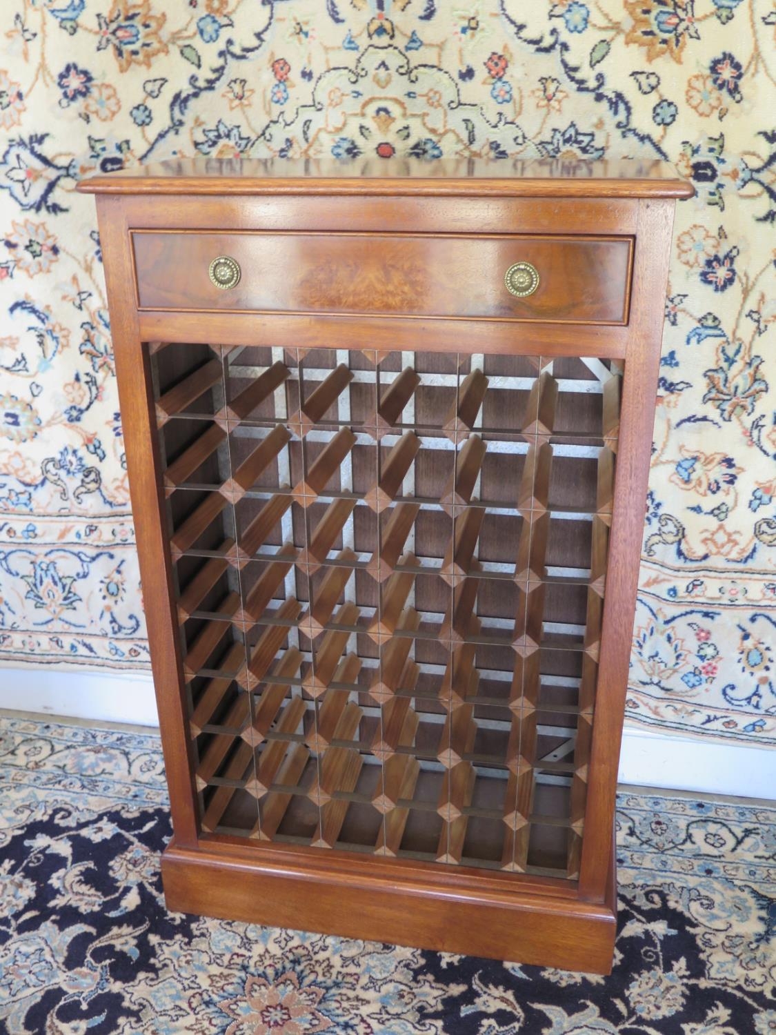 A Walnut Wine Rack With A Single Drawer Above A 48 Bottle Rack