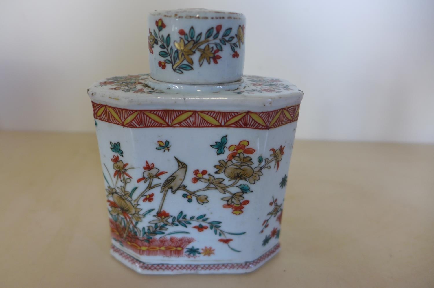 A Chinese 18th Century Porcelain Tea Caddy And Cover Decorated With Prunus And Birds In A Red And Gr