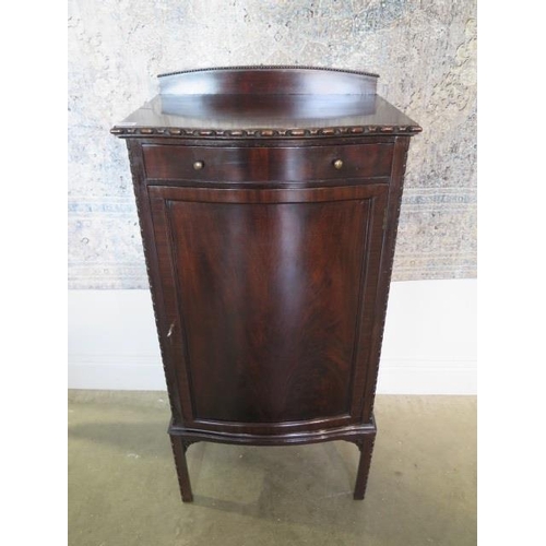 32A - A circa 1900s mahogany bow fronted cupboard with shelves and upper frieze drawer, 109cm tall x 54cm ... 