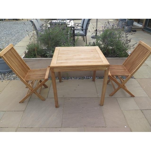 11 - A new boxed teak bistro table 70cm x 70cm and two folding dining chairs.