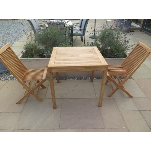 7 - A new boxed teak bistro table 70cm x 70cm and two folding dining chairs.