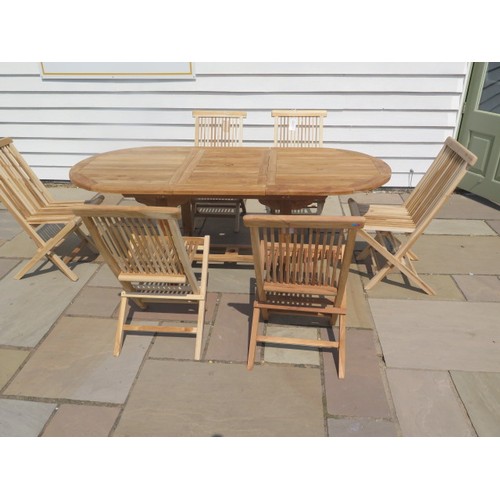 35 - A new boxed teak garden table & 6 folding chairs. Table size extends from 150cm to 200cm with a 90cm... 