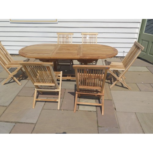 37 - A new boxed teak garden table & 6 folding chairs. Table size extends from 150cm to 200cm with a 90cm... 