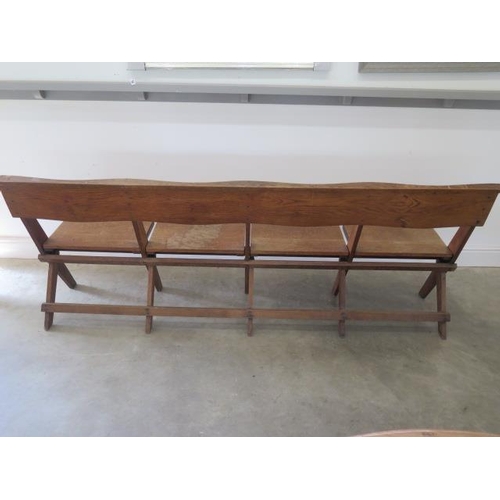 55 - An oak folding seat pew ideal for pubs or restaurants, 211 cm wide x 81 cm tall