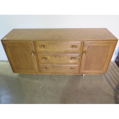 13 - An Ercol blond elm sideboard with 3 drawers and 2 cupboard doors, 67cm tall, 156cm x 43cm, in good c... 