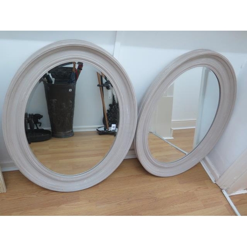 17 - A pair of painted  oval mirrors, 67cm x 86cm
in good condition