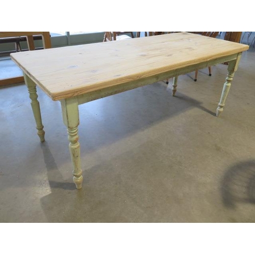 32 - A pine kitchen table with a stripped top on  painted turned legs, 76cm tall x 186cm x 76cm