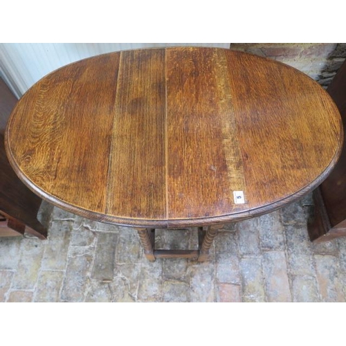 5 - A 1930's oak barleytwist dropleaf side table, 71cm tall x 60cm x 90cm