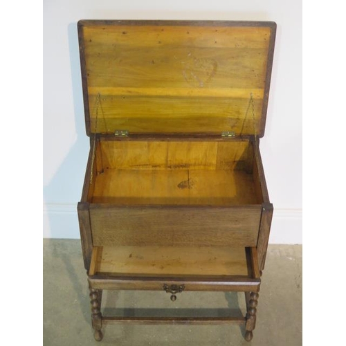 63 - An oak work box with chessboard top, 54cm tall x 49cm x 34cm