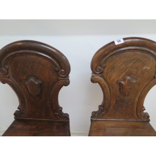66 - A pair of oak 19th century hall chairs