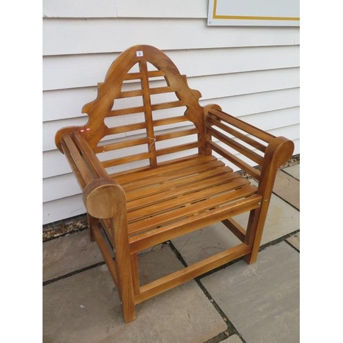 2 - A teak garden chair, ex-display
