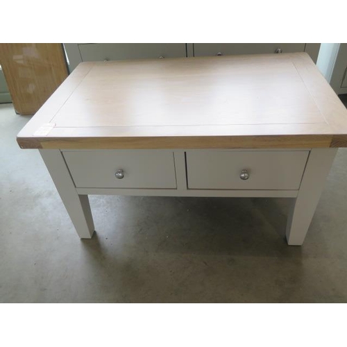 21 - A painted coffee table with 2 drawers and a chalked oak top, 90cm wide x 51cm high, ex-display as ne... 