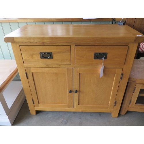 23 - A oak sideboard with 2 drawers and 2 cupboard doors, as new, 100cm wide x 88cm high x 45cm deep