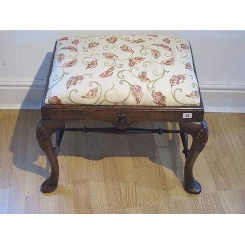 69 - A beechwood stool on shaped legs with turned stretchers, recently reupholstered, 50cm tall x 62cm x ... 