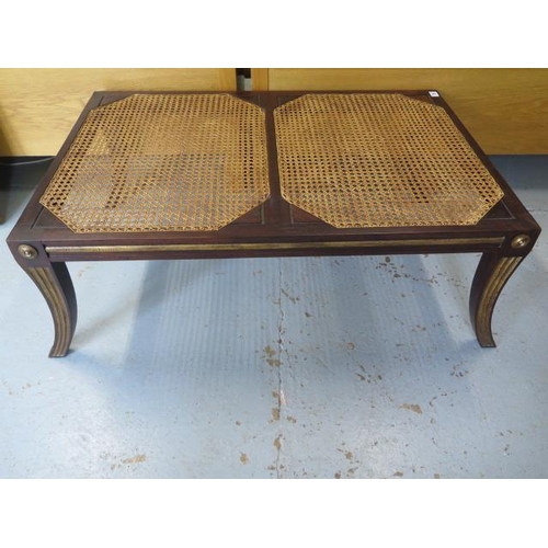 15 - A mahogany and gilt bergere stool in the Regency style, 39cm tall x 100cm x 66cm top
