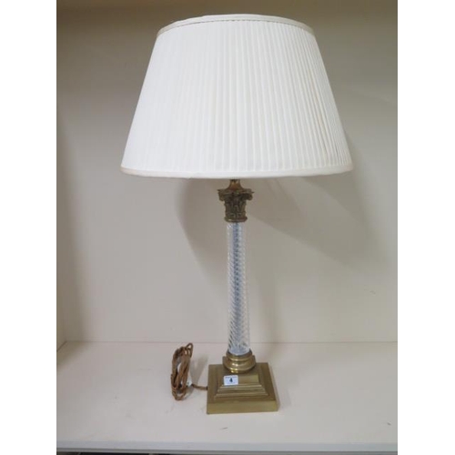 4 - A brass table lamp with a twisted glass stem with shade, 74cm tall