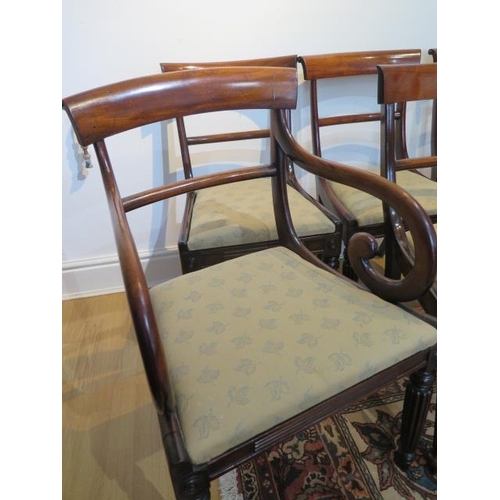 51 - A set of eight early 19th century mahogany bar back dining chairs, including two carvers with uphols... 
