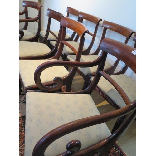 51 - A set of eight early 19th century mahogany bar back dining chairs, including two carvers with uphols... 