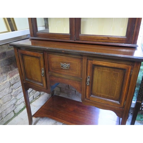 54 - An Edwardian mahogany and line inlaid display cabinet, with glazed hinged doors enclosing two shelve... 