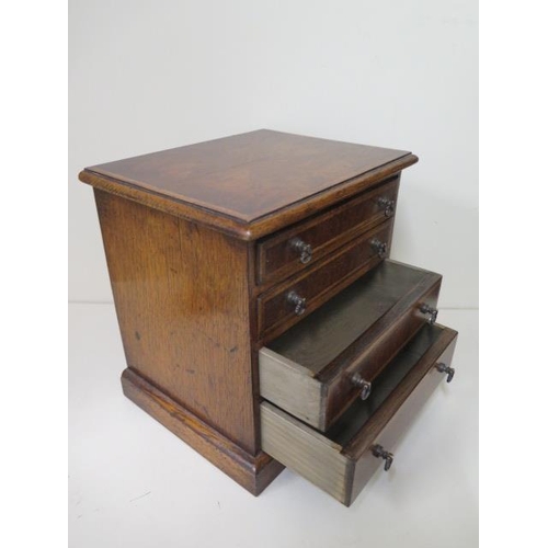 28 - A small walnut four drawer / trinket chest, made by a local craftsman to a high standard, 26cm tall ... 