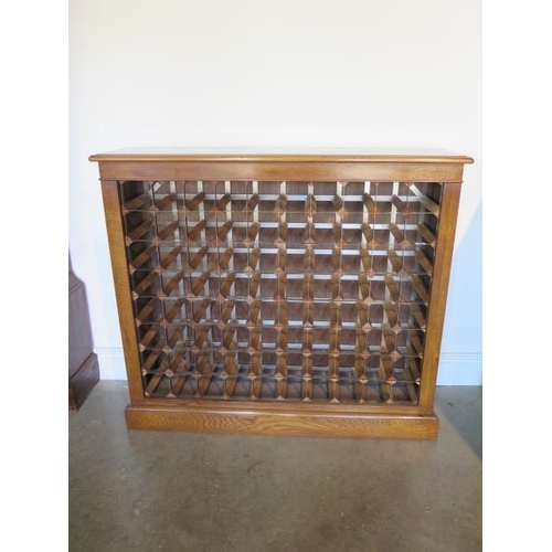 32 - A burr oak 80 bottle wine rack made by a local craftsman to a high standard, 98cm tall x 111cm wide ... 