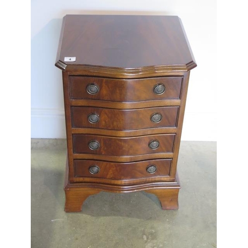 4 - A mahogany effect four drawer bedside chest in good condition, 61cm tall x 41cm x 36cm
