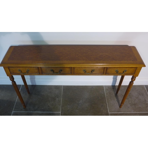 17 - A burr wood four drawer hall/side table on turned reeded legs made by a local craftsman to a high st... 