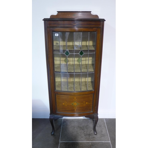 53 - A 1920's decorated mahogany bowfronted display cabinet with leaded glazed door, 145cm tall x 59cm x ... 