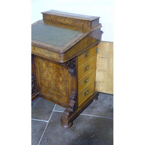 54 - A 19th century walnut Davenport with a single door enclosing four drawers, in need of some restorati... 