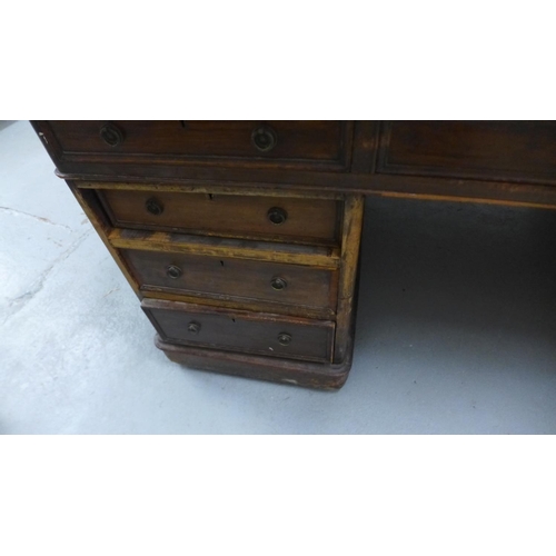 62 - A late Victorian mahogany twin pedestal partners desk with an arrangement of 6 drawers and a cupboar... 