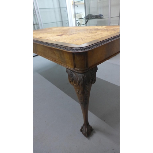 64 - A mahogany library table with a leather inset top on carved cabriole legs, 77cm tall x 166cm x 91cm,... 