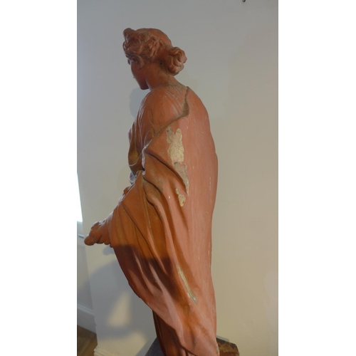 72 - A country house terracota effect classical figure, 105cm tall, on a weighted faux marble base, 67cm ... 
