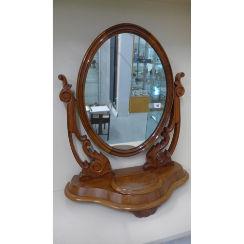 95 - A Victorian mahogany oval dressing mirror, 77cm tall x 65cm wide in good condition