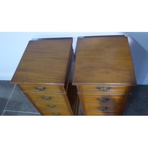 56 - A pair of mahogany four drawer pedestal bedside chests adapted from an Edwardian desk