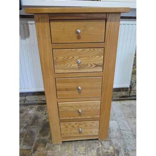 11 - A modern oak five drawer Wellington type chest - Height 101cm x 54cm x 35cm