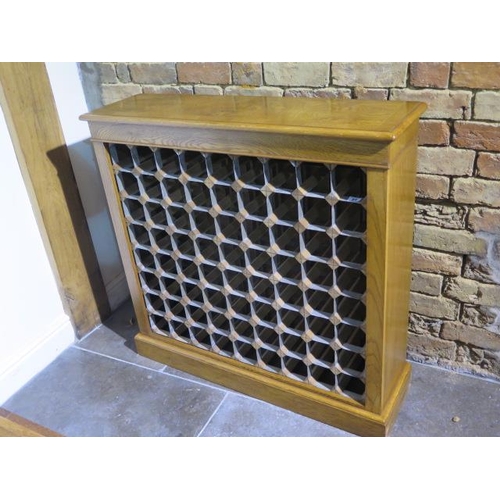 23 - A burr oak 72 bottle wine rack made by a local craftsman to a high standard - Height 96cm x 99cm x 2... 