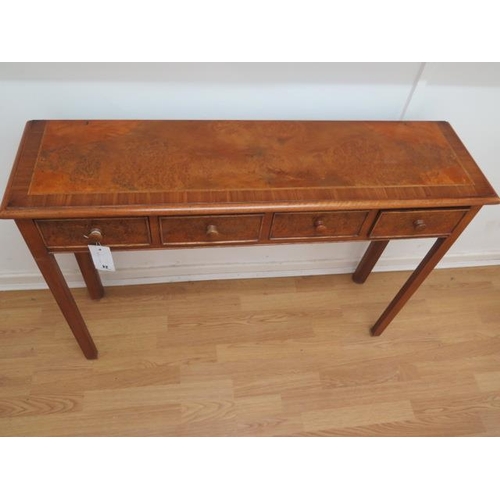 24 - A walnut four drawer hall table made by a local craftsman to a high standard - Height 77cm x 110cm x... 