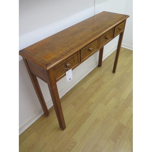 24 - A walnut four drawer hall table made by a local craftsman to a high standard - Height 77cm x 110cm x... 