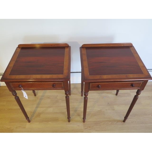 26 - A pair of crossband lamp tables with a single drawer on turned reeded legs made by a local craftsman... 
