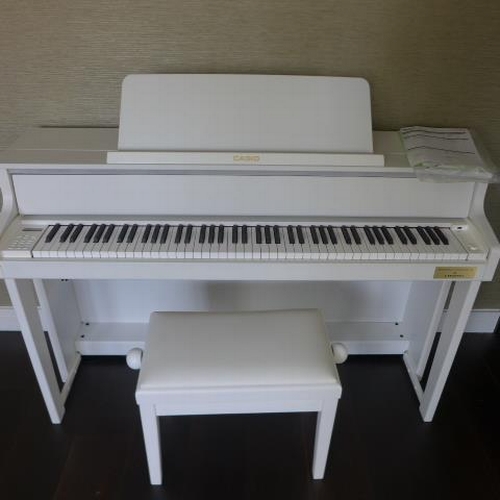 10A - A Casio GP-300 Celviano Grand Satin white electric piano and a matching stool purchased from Millers... 