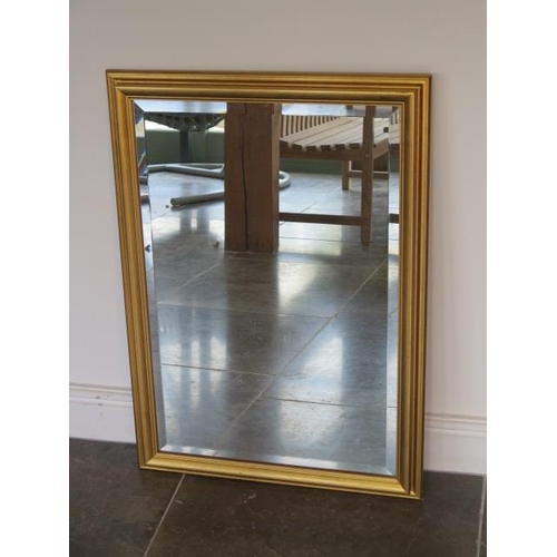 5 - A gilt framed wall mirror - 82cm x 59cm