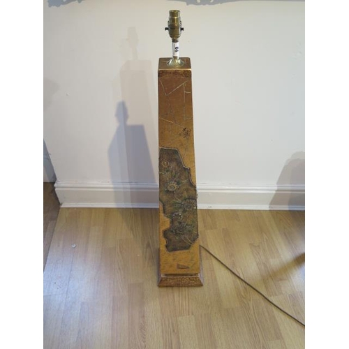 19 - A beautiful gold covered obelisk shaped lamp with defined intricate pattern and floral design in rel... 