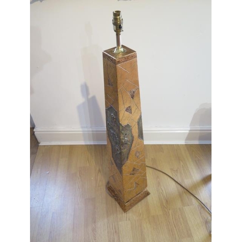 19 - A beautiful gold covered obelisk shaped lamp with defined intricate pattern and floral design in rel... 